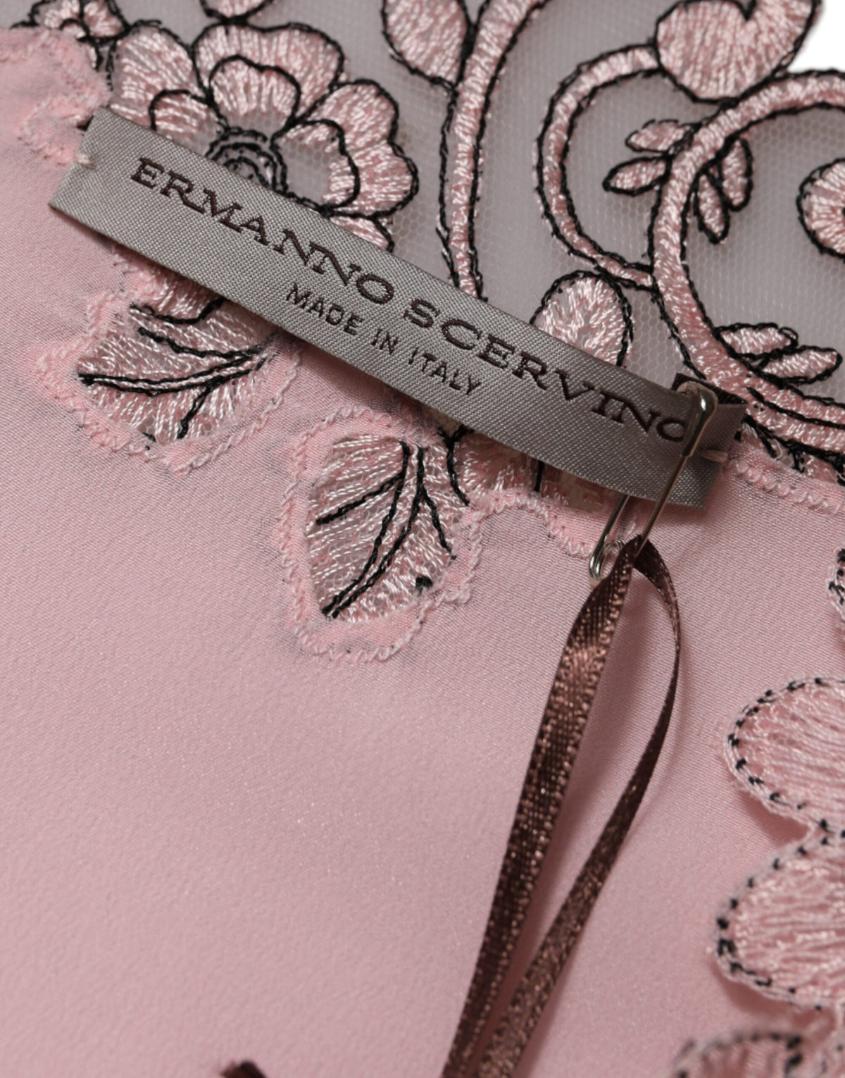Indulge in the Ermanno Scervino Pink Floral Lace Midi Dress, a silk masterpiece that embodies Italian craftsmanship and elevates your allure for every exquisite occasion.