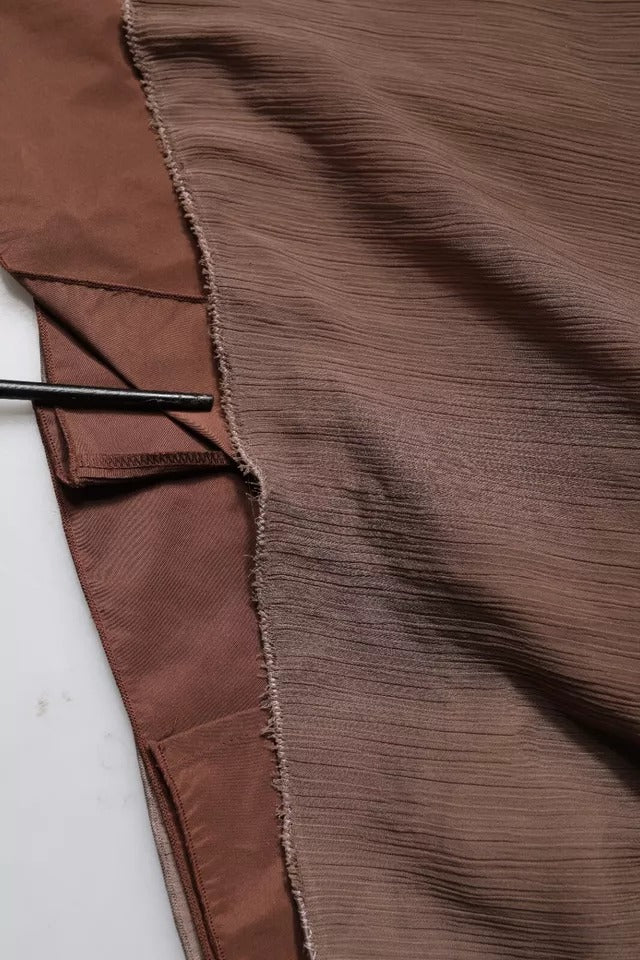 Experience the allure of the Peserico Brown Sleeveless Deep V-neck A-line Long Maxi Dress, crafted in Italy from luxurious materials, embodying timeless elegance and sophistication.
