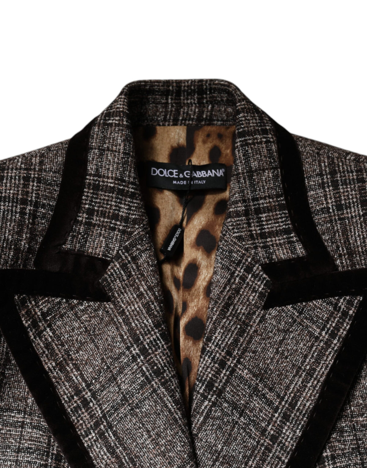 Elevate your style with the Dolce & Gabbana Brown Plaid Long Sleeve Cropped Coat Jacket, a masterpiece of Italian craftsmanship that embodies timeless luxury and sophistication.