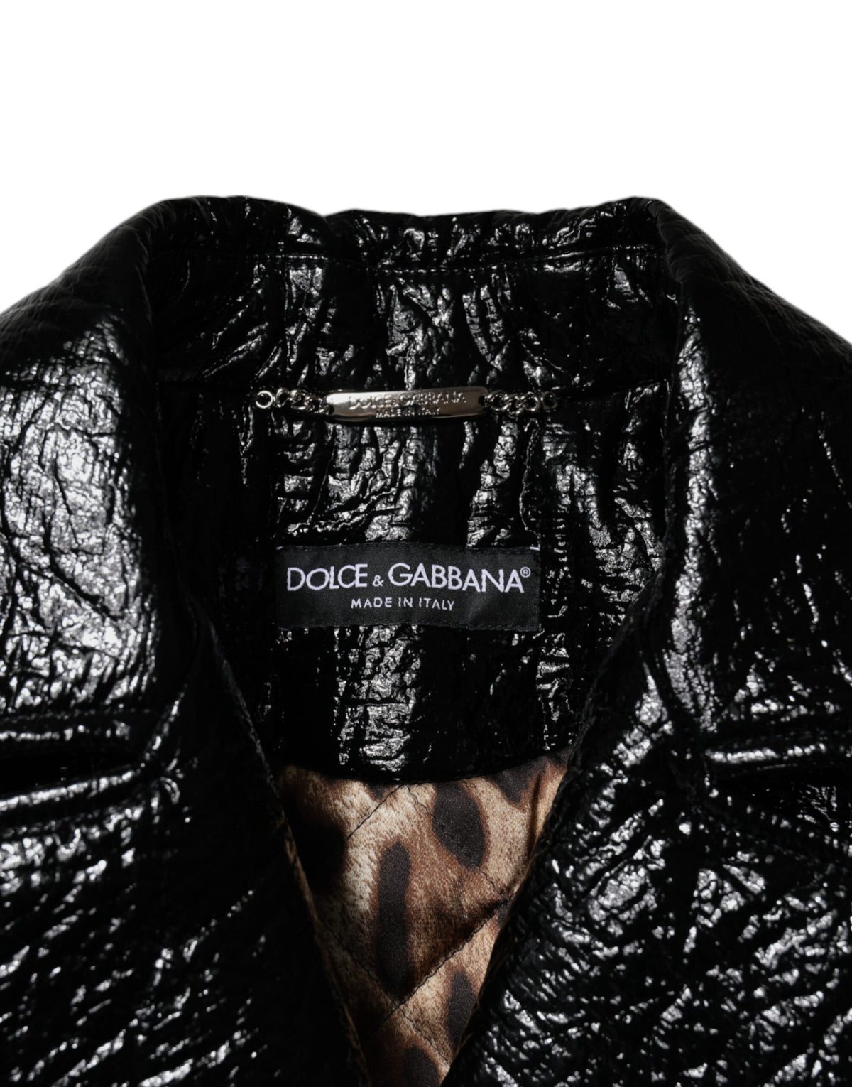 Experience the allure of the Dolce & Gabbana Black Leather Cropped Long Sleeve Coat Jacket, a masterpiece of Italian craftsmanship that redefines elegance and sophistication.