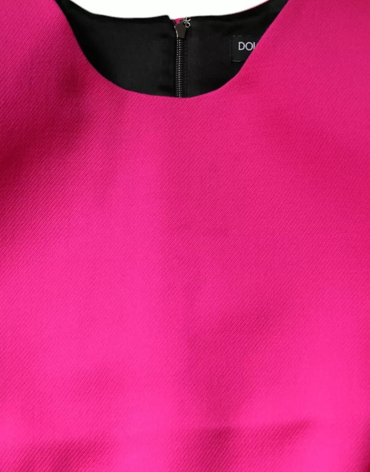 Indulge in the exquisite Dolce & Gabbana Pink Sleeveless Bodycon A-line Mini Dress, crafted from luxurious virgin wool and silk for a flawless fit that embodies timeless elegance.