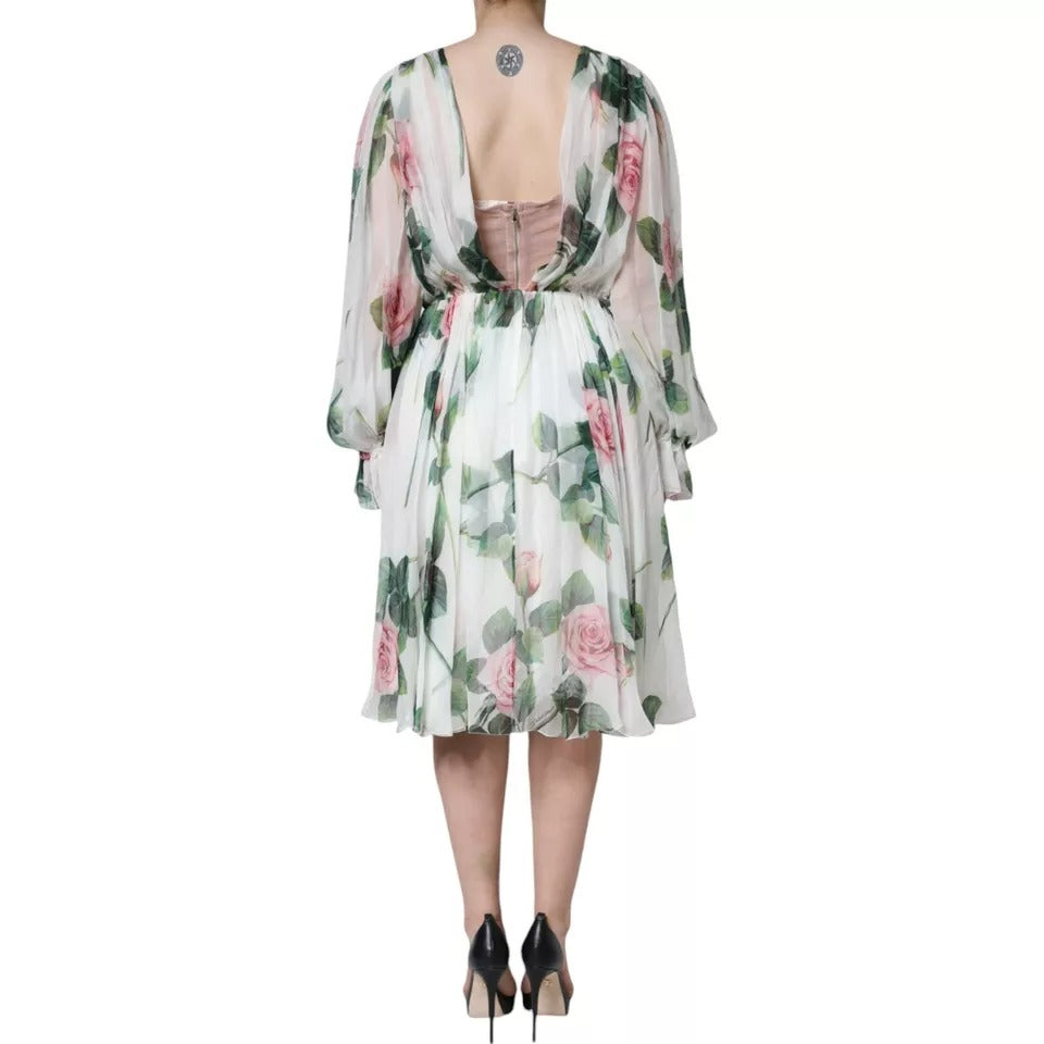 Indulge in the exquisite allure of the Dolce & Gabbana White Silk Floral Print A-line Midi Dress, a masterpiece of Italian craftsmanship that embodies timeless elegance and romantic sophistication.