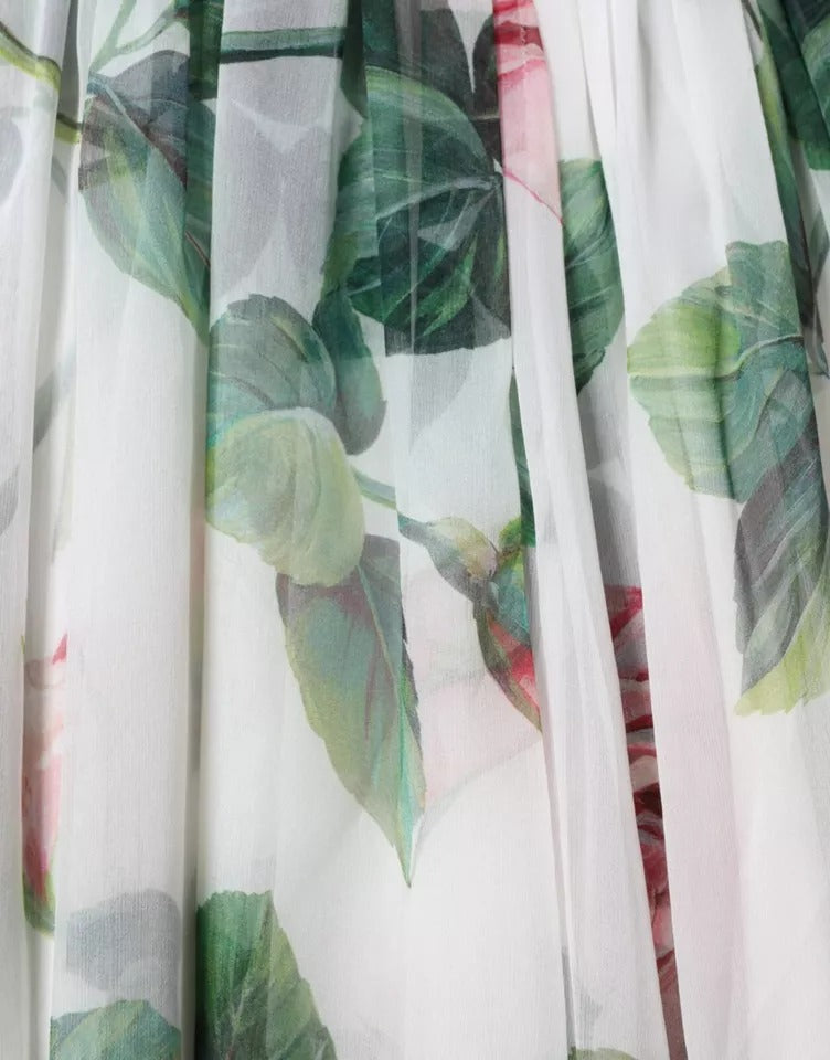 Indulge in the exquisite allure of the Dolce & Gabbana White Silk Floral Print A-line Midi Dress, a masterpiece of Italian craftsmanship that embodies timeless elegance and romantic sophistication.