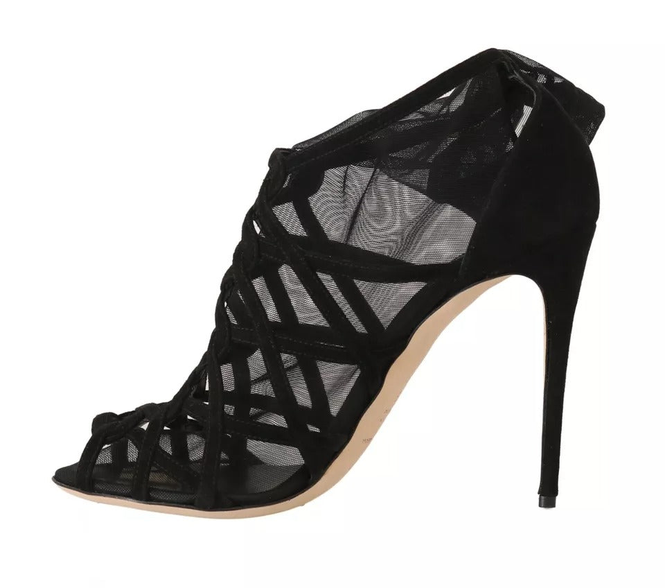 Step into unparalleled elegance with Dolce & Gabbana Black Suede Stilettos Booties, where luxurious suede meets exquisite Italian craftsmanship for a timeless allure.