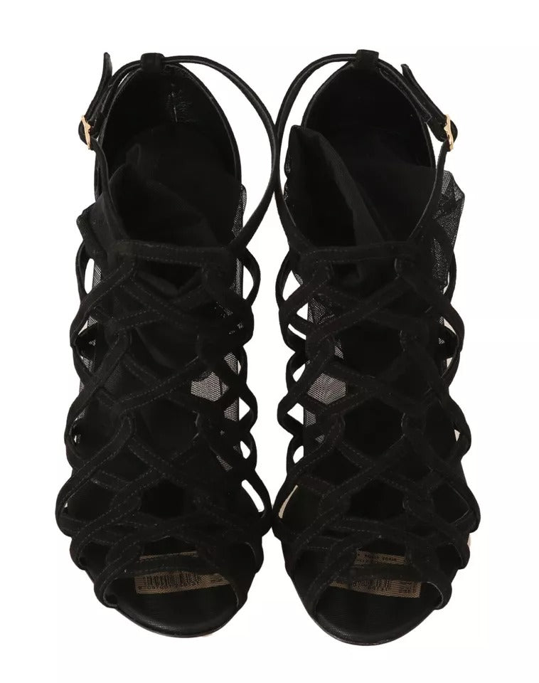 Step into unparalleled elegance with Dolce & Gabbana Black Suede Stilettos Booties, where luxurious suede meets exquisite Italian craftsmanship for a timeless allure.