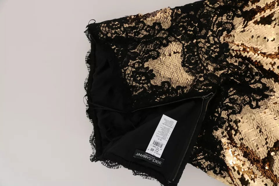 Discover the exquisite Dolce & Gabbana Gold Strapless Sequin Embellished Lace Dress, a masterpiece of haute couture that embodies luxury and sophistication for unforgettable moments.