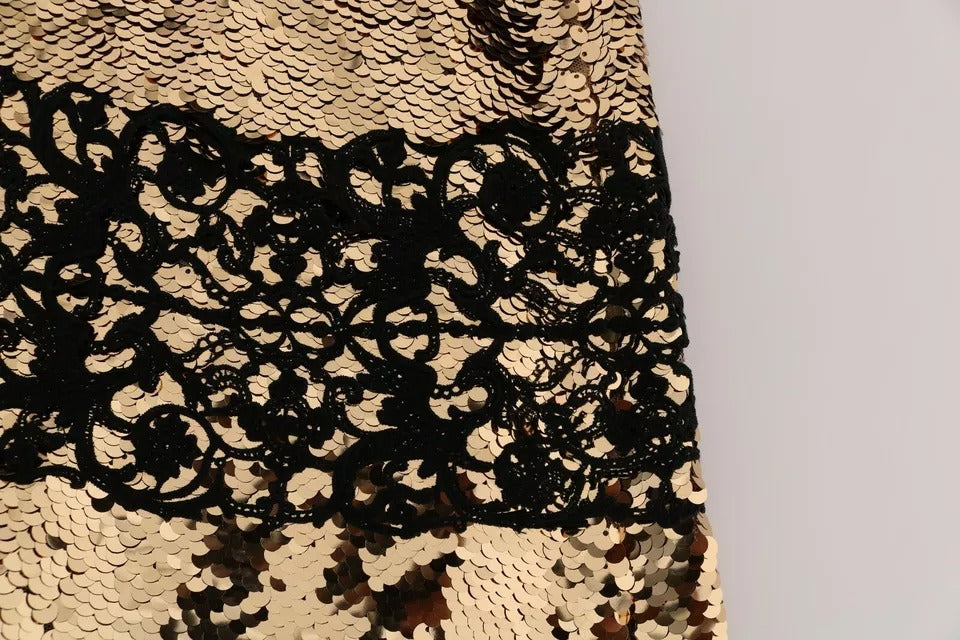 Indulge in the exquisite allure of the Dolce & Gabbana Gold Strapless Sequin Embellished Lace Dress, a masterpiece of haute couture crafted from luxurious fabrics, perfect for unforgettable moments.