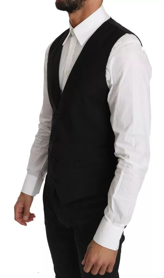 Indulge in the Dolce & Gabbana Black Wool Logo Waistcoat Vest, a masterpiece of Italian craftsmanship, blending timeless elegance with luxurious comfort for the discerning individual.