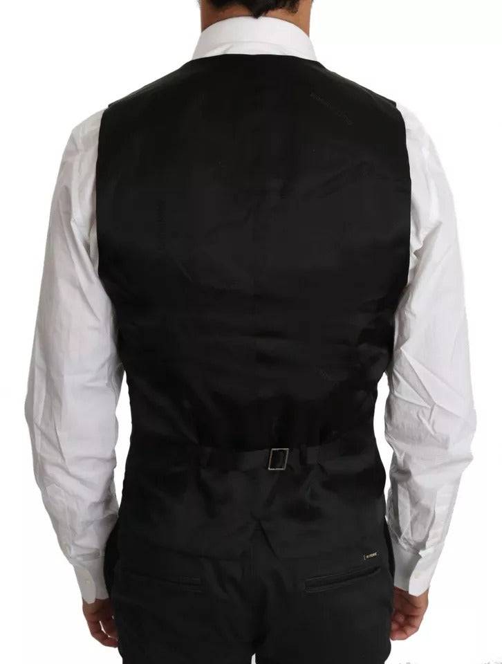 Elevate your style with the Dolce & Gabbana Black Wool Logo Waistcoat Vest, a masterpiece of Italian craftsmanship that embodies timeless luxury and sophistication.