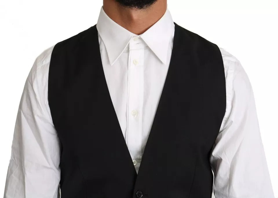 Discover the Dolce & Gabbana Black Wool Logo Waistcoat Vest, a timeless piece of refined luxury crafted from premium wool, perfect for sophisticated occasions and elegant styling.