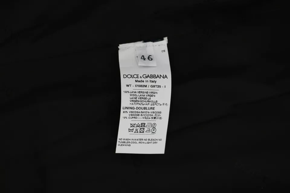 Indulge in the exquisite elegance of the Dolce & Gabbana Black Wool Logo Waistcoat Vest, a timeless piece crafted from premium wool, perfect for sophisticated occasions.
