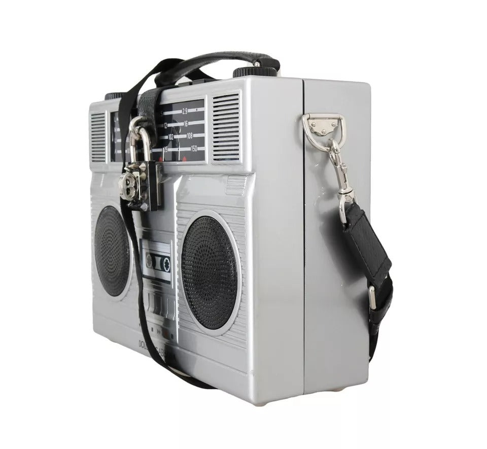 Elevate your style with the Dolce & Gabbana Silver Retro Radio Boombox Bag, a limited edition masterpiece of artisanal craftsmanship in luxurious wood and leather.
