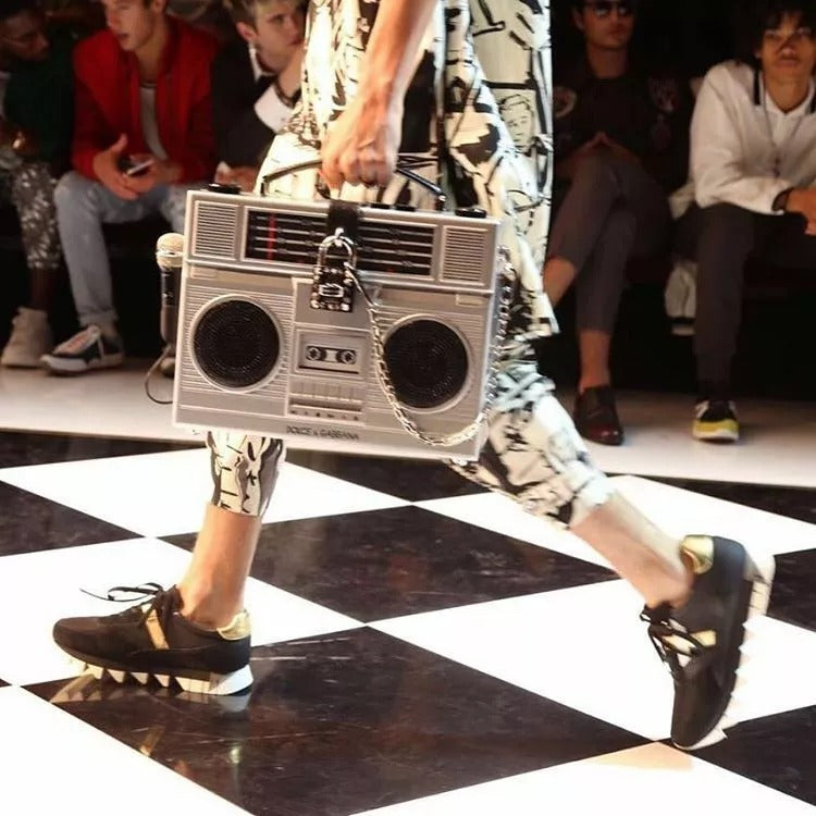 Elevate your style with the Dolce & Gabbana Silver Retro Radio Boombox Bag, a limited edition masterpiece of artisanal wood and leather, exuding timeless elegance and exclusivity.
