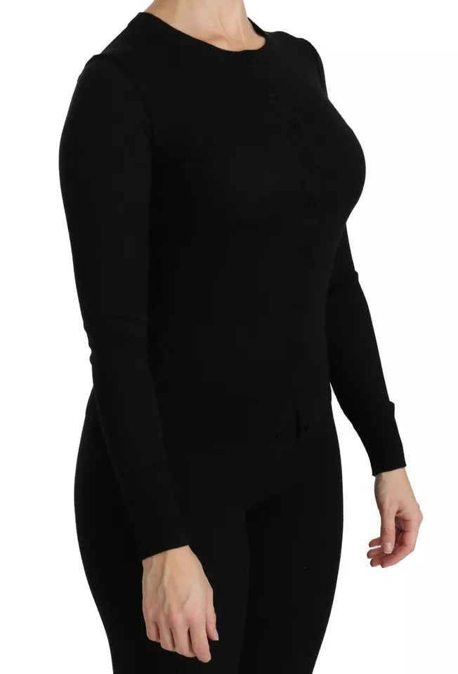 Experience the allure of Dolce & Gabbana's Black Virgin Wool Long Sleeve Top, a masterpiece of Italian craftsmanship that embodies timeless elegance and refined luxury.