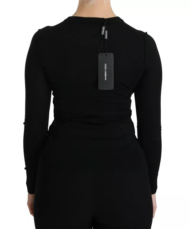 Indulge in the luxurious allure of the Dolce & Gabbana Black Virgin Wool Long Sleeve Top, a timeless piece that embodies sophistication and elegance for the discerning individual.
