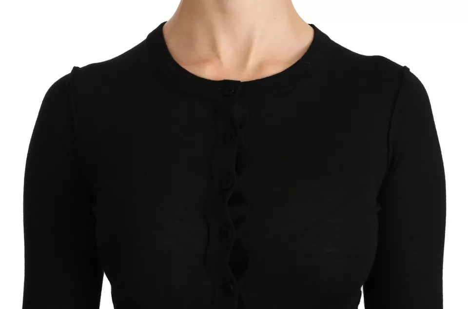 Experience the allure of Dolce & Gabbana's Black Virgin Wool Long Sleeve Top, a masterpiece of Italian craftsmanship that embodies timeless elegance and sophistication.