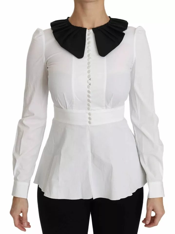 Experience the allure of Dolce & Gabbana's exquisite blouse, crafted from luxurious cotton and elastane, embodying timeless elegance and exceptional Italian craftsmanship.