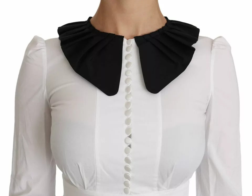 Elevate your wardrobe with the Dolce & Gabbana Black White Decorative Buttons Blouse, a masterpiece of Italian craftsmanship in luxurious cotton and elastane, perfect for the discerning individual.
