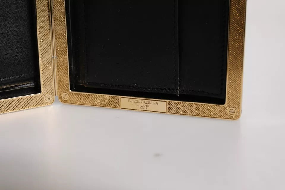 Indulge in the exquisite Dolce & Gabbana Black Leather Gold Frame Clutch, a symbol of timeless elegance and impeccable craftsmanship, perfect for any luxurious soirée.
