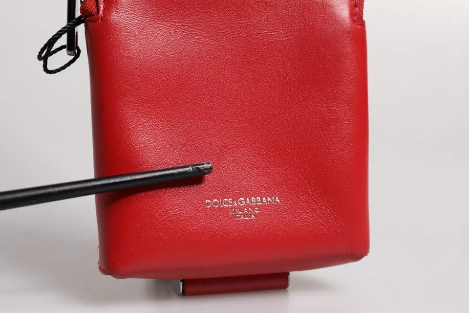 Experience the allure of Dolce & Gabbana's Red Leather Logo Zip Around Card Holder Wallet, a masterpiece of Italian craftsmanship that embodies timeless elegance and sophistication.