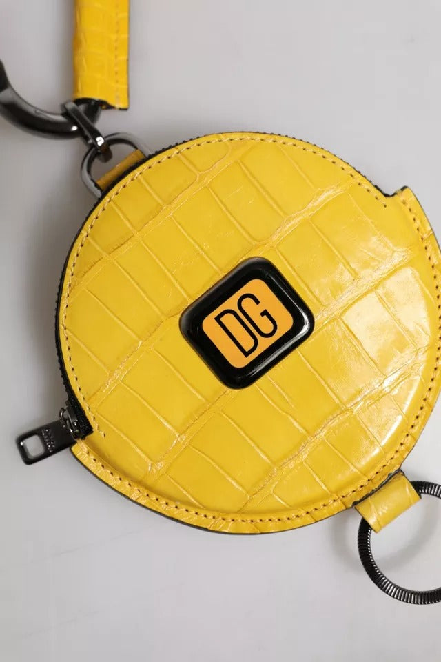 Elevate your style with the Dolce & Gabbana Yellow Round Leather DG Logo Coin Purse, a masterpiece of Italian craftsmanship that embodies luxury and sophistication.