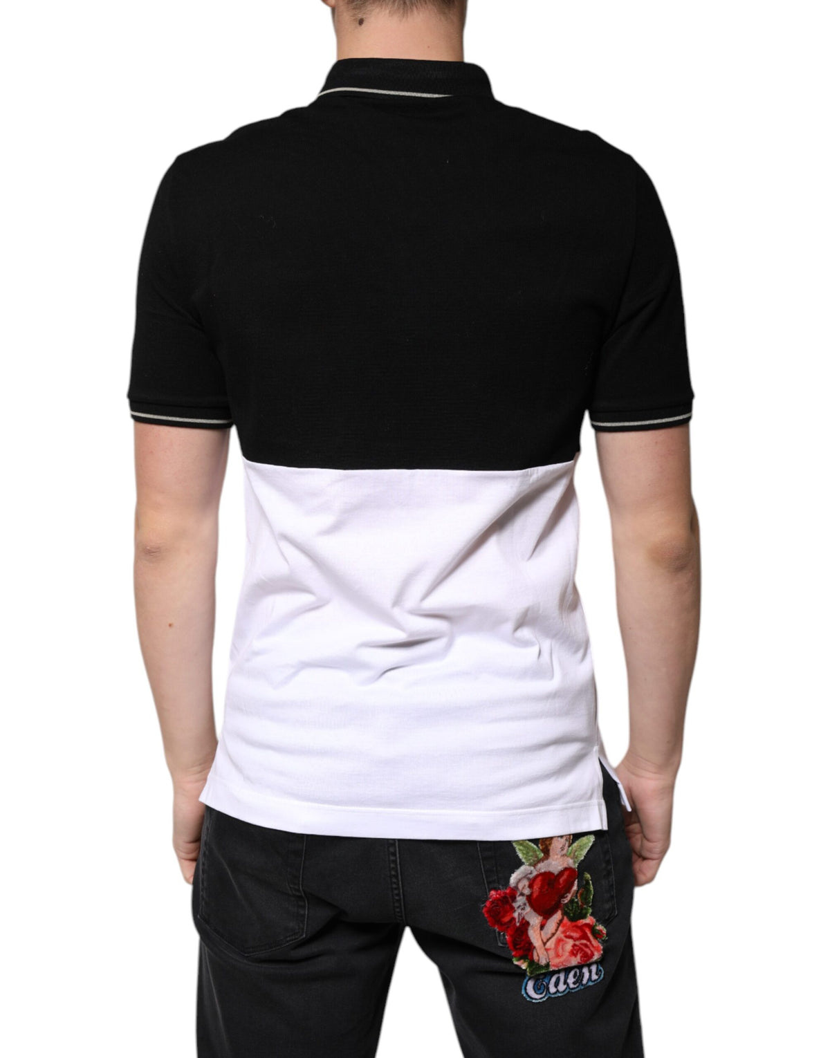 Elevate your wardrobe with the Dolce & Gabbana Black White Cotton Short Sleeves Polo T-shirt, a masterpiece of Italian craftsmanship that embodies timeless elegance and sophistication.