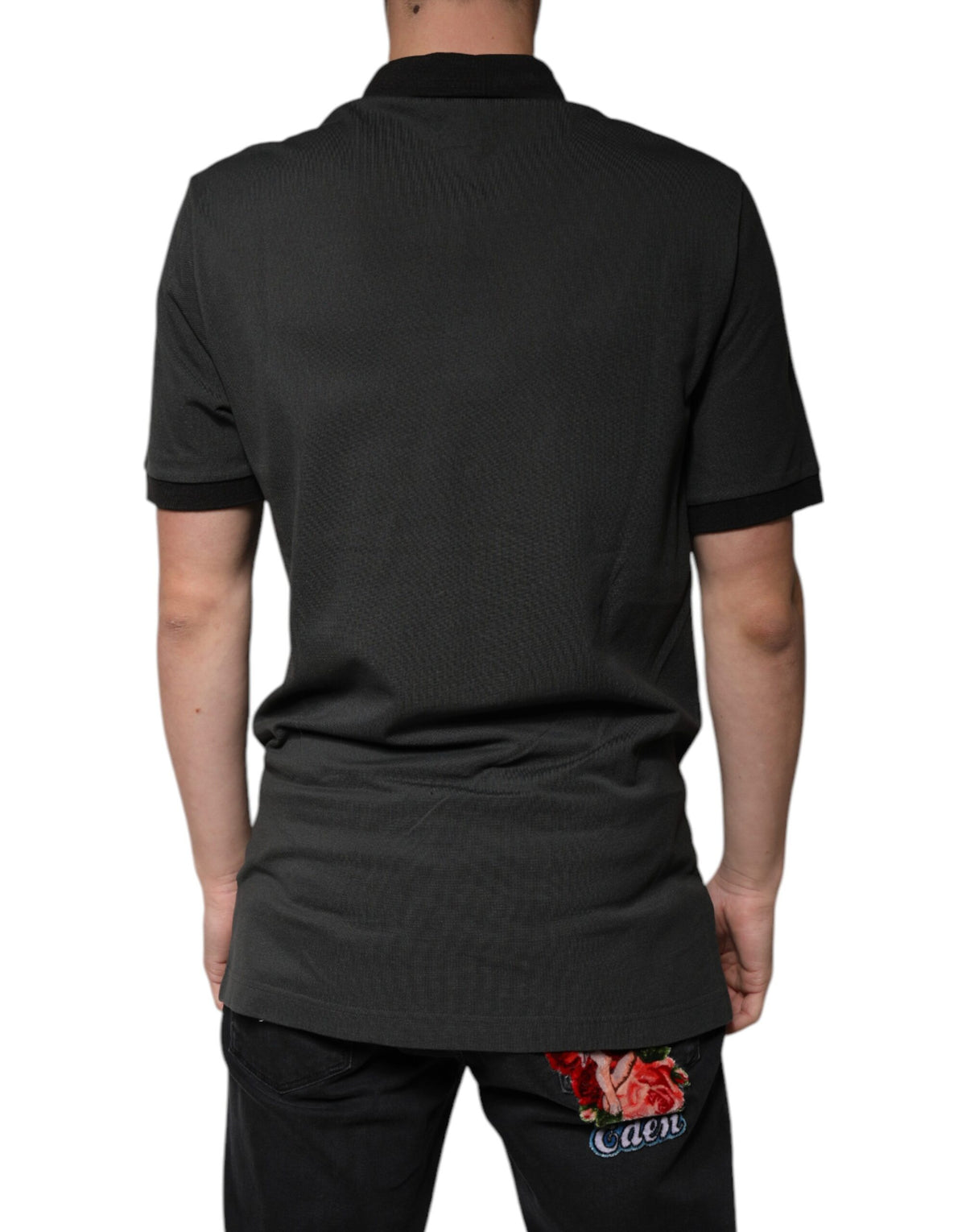 Indulge in the exquisite Dolce & Gabbana Black Logo Print Collared Cotton Polo T-shirt, where Italian craftsmanship meets timeless elegance, perfect for the discerning connoisseur.