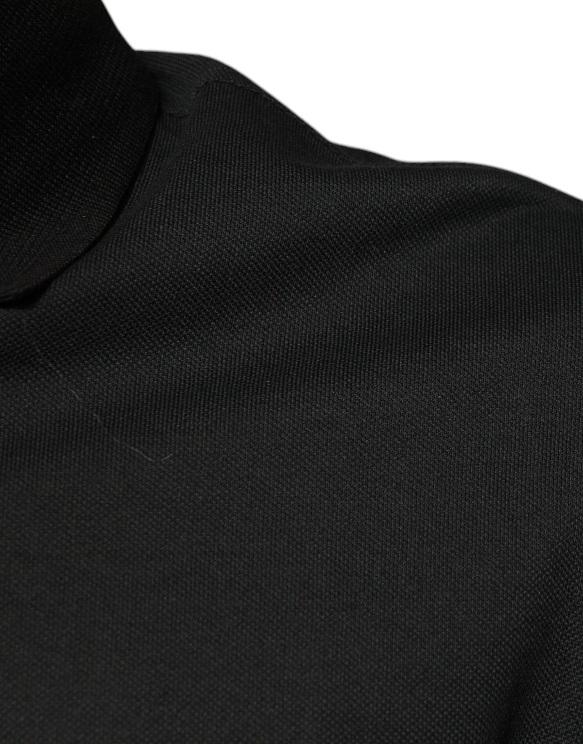 Indulge in the exquisite Dolce & Gabbana Black Logo Print Collared Cotton Polo T-shirt, a masterpiece of Italian craftsmanship that elevates your style with timeless elegance.