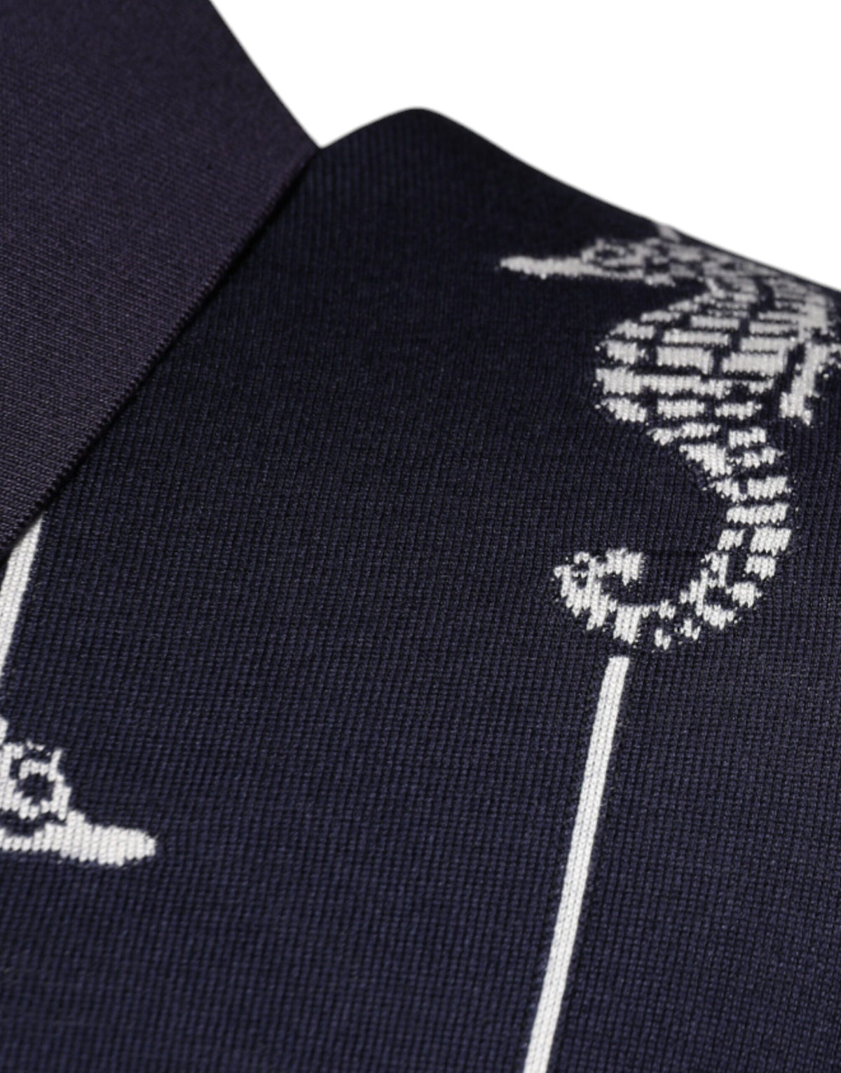 Indulge in the exquisite Dolce & Gabbana Dark Blue Sea Horse Collared Polo T-shirt, crafted from luxurious silk for timeless elegance and effortless sophistication.