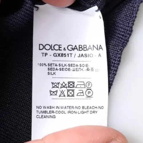 Indulge in the exquisite Dolce & Gabbana Dark Blue Sea Horse Collared Polo T-shirt, crafted from luxurious silk for timeless elegance that captivates and empowers.