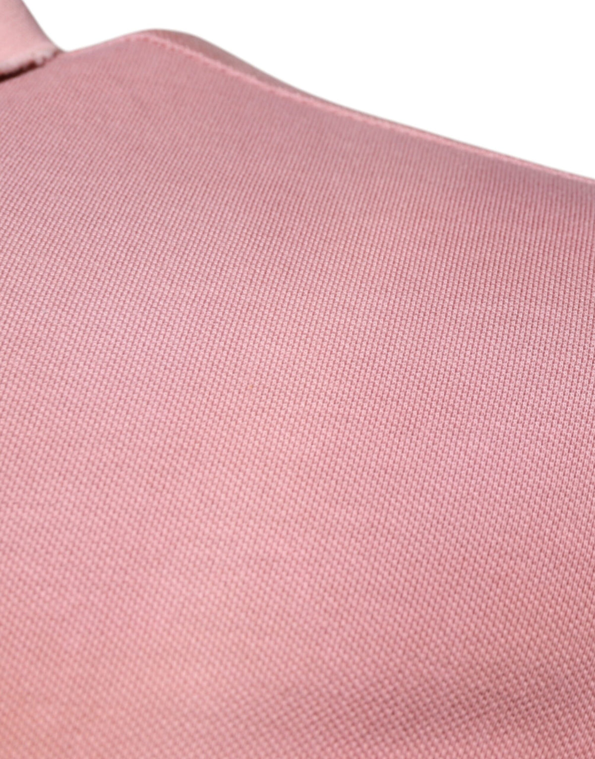 Indulge in the exquisite Dolce & Gabbana Pink Crown Collared Polo, a luxurious 100% cotton masterpiece that embodies sophistication and timeless elegance for the discerning individual.