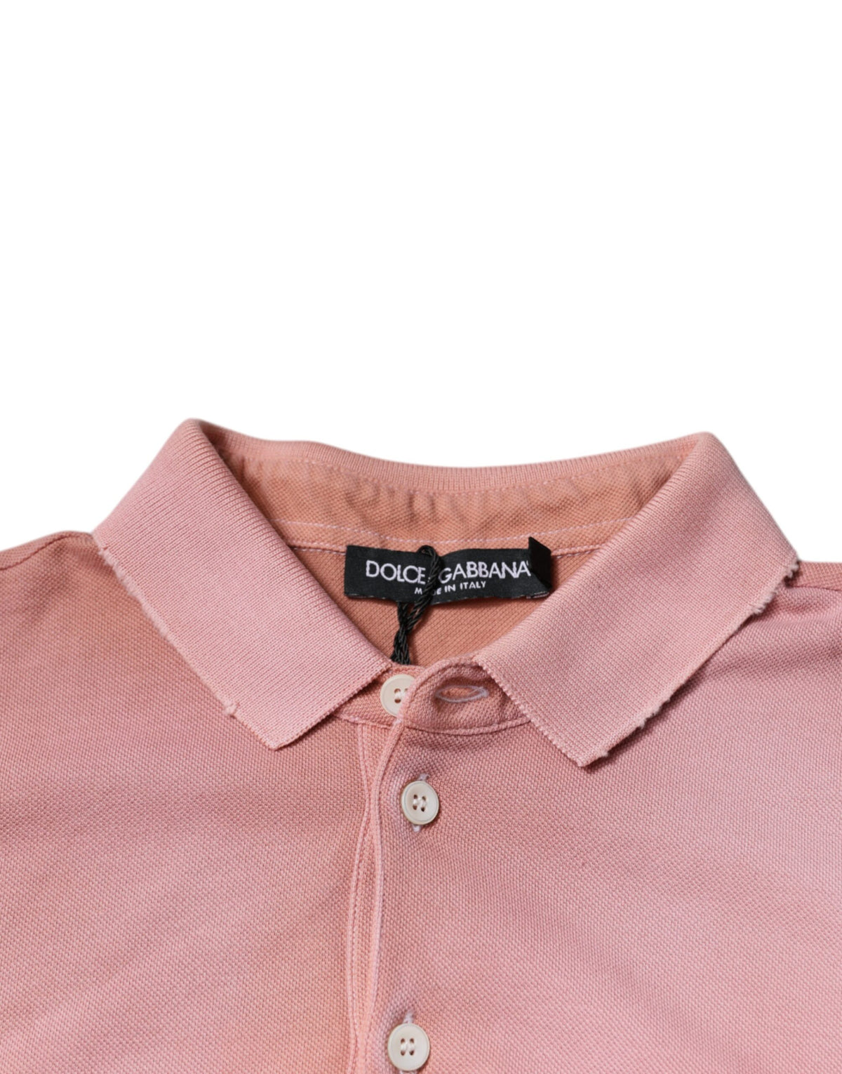 Indulge in the exquisite Dolce & Gabbana Pink Crown Collared Polo, crafted from 100% cotton, embodying timeless elegance and Italian craftsmanship for the discerning individual.