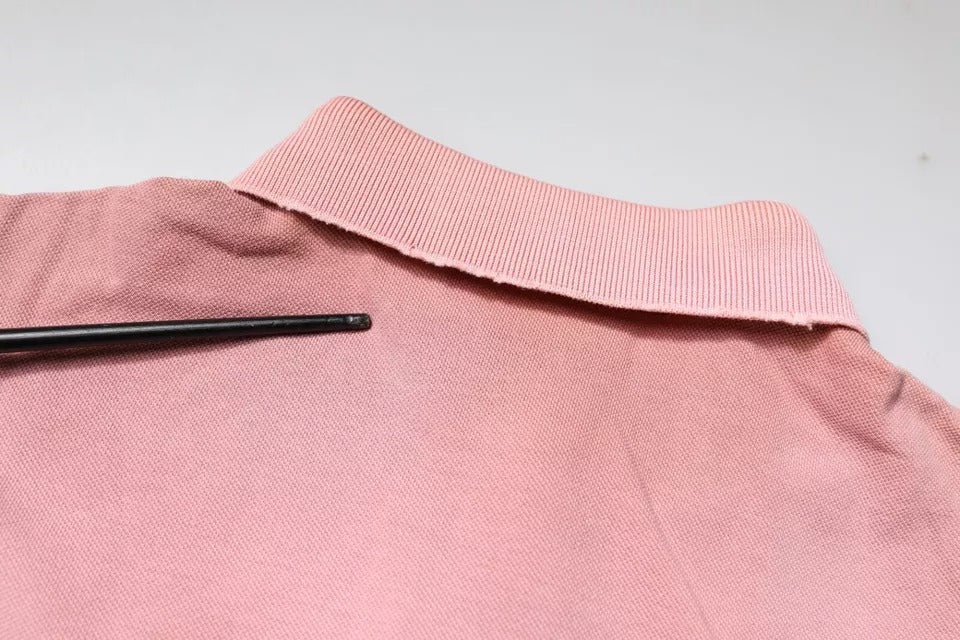 Elevate your wardrobe with the Dolce & Gabbana Pink Crown Collared Polo T-shirt, a luxurious blend of 100% cotton and exquisite Italian craftsmanship, embodying timeless elegance.