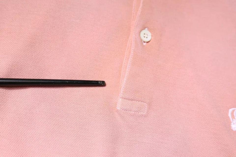Elevate your wardrobe with the Dolce & Gabbana Pink Crown Collared Polo T-shirt, a testament to Italian craftsmanship, luxurious cotton, and timeless elegance.