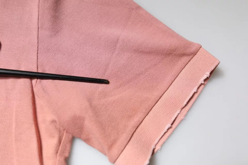 Elevate your wardrobe with the Dolce & Gabbana Pink Crown Collared Polo, a luxurious blend of Italian craftsmanship and timeless elegance in 100% cotton.