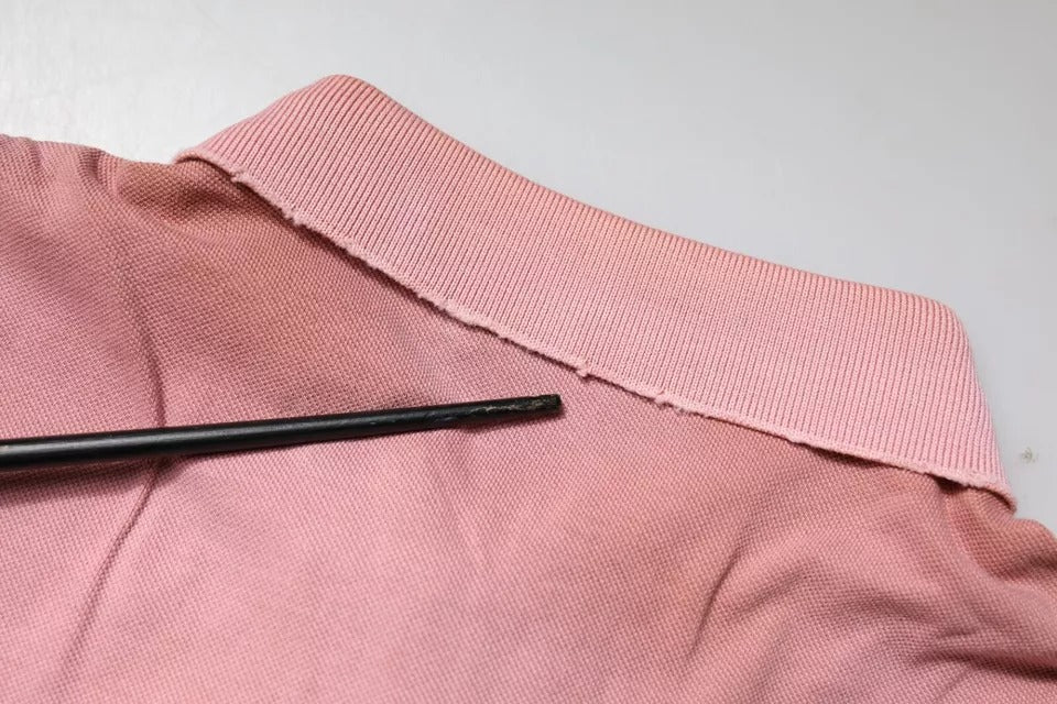 Elevate your wardrobe with the Dolce & Gabbana Pink Crown Collared Polo, crafted from luxurious Italian cotton, embodying sophistication and timeless elegance.