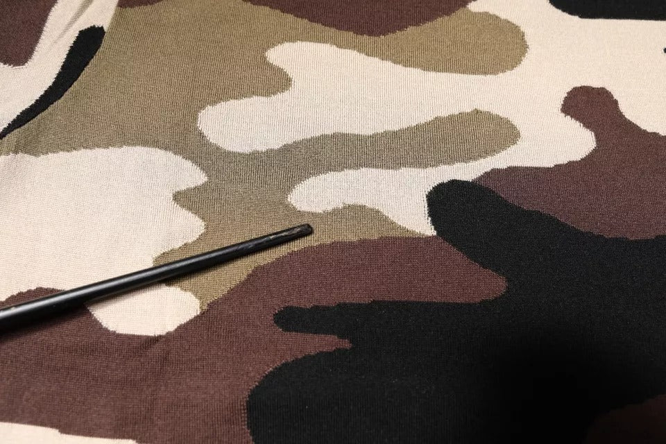 Indulge in the exquisite Dolce & Gabbana Multicolor Camouflage Polo, a silk masterpiece that embodies timeless elegance and sophisticated allure for the discerning individual.