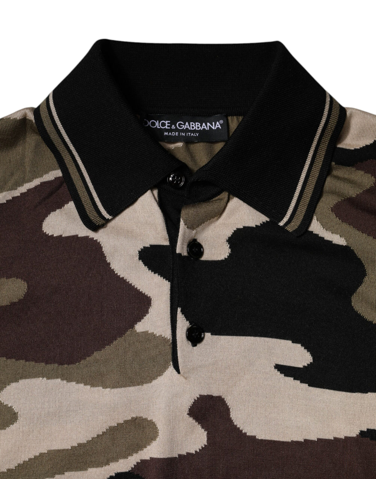 Elevate your style with the Dolce & Gabbana Multicolor Camouflage Collared Polo T-shirt, a silk masterpiece that embodies luxury and Italian craftsmanship for the discerning individual.