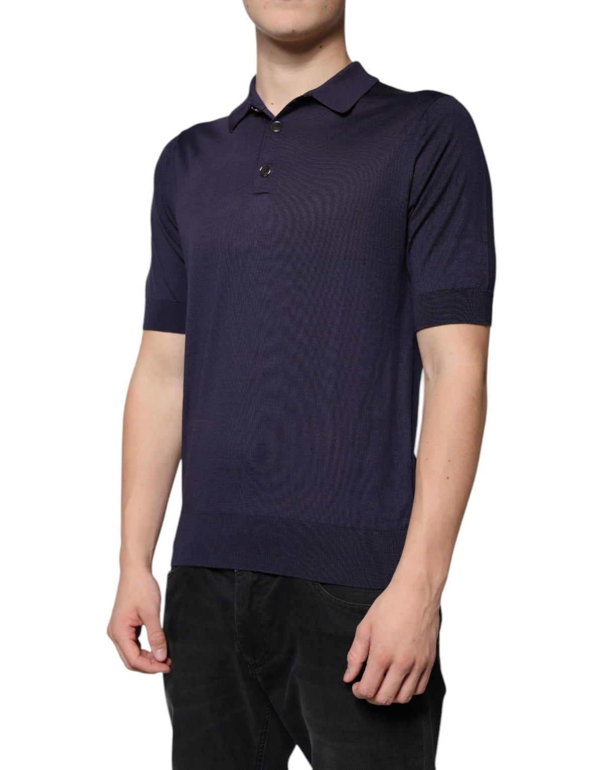 Indulge in the exquisite allure of Dolce & Gabbana's Blue Silk Collared Polo T-shirt, a masterpiece of Italian craftsmanship that elevates your style with timeless elegance.