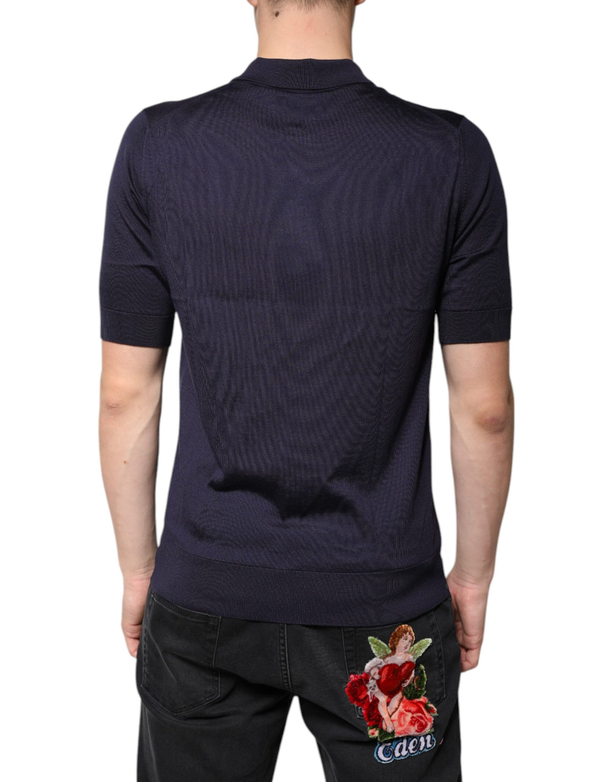 Indulge in the exquisite allure of Dolce & Gabbana's Blue Silk Collared Polo T-shirt, a timeless piece that embodies Italian craftsmanship and luxurious elegance.