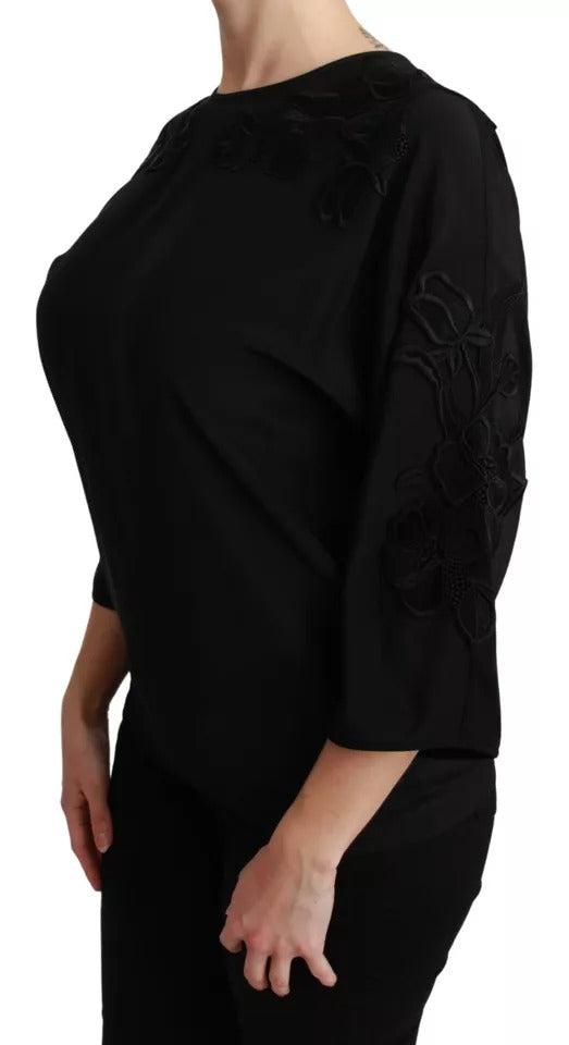 Elevate your wardrobe with the Dolce & Gabbana Black Floral Embroidered Blouse, a silk masterpiece that embodies timeless elegance and exquisite craftsmanship for the discerning individual.