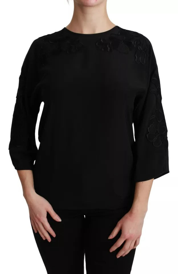 Elevate your wardrobe with the Dolce & Gabbana Black Floral Embroidered Blouse, a silk masterpiece that embodies timeless elegance and exquisite craftsmanship for the discerning individual.
