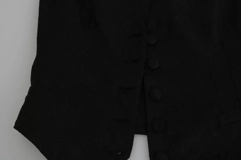 Indulge in the exquisite allure of the Dolce & Gabbana Black Lace Waistcoat Slim Vest, crafted in Italy from luxurious silk and lace, a timeless statement of elegance and sophistication.