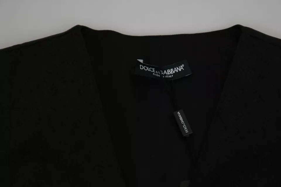 Indulge in the exquisite allure of the Dolce & Gabbana Black Lace Waistcoat Slim Vest, a timeless piece crafted in Italy that embodies sophistication and sensuality.
