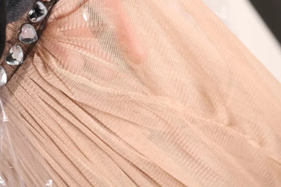 Indulge in the exquisite allure of the Dolce & Gabbana Brown Silk Sleeveless Shift Maxi Dress, a timeless masterpiece crafted from luxurious silk, perfect for elegant soirées.