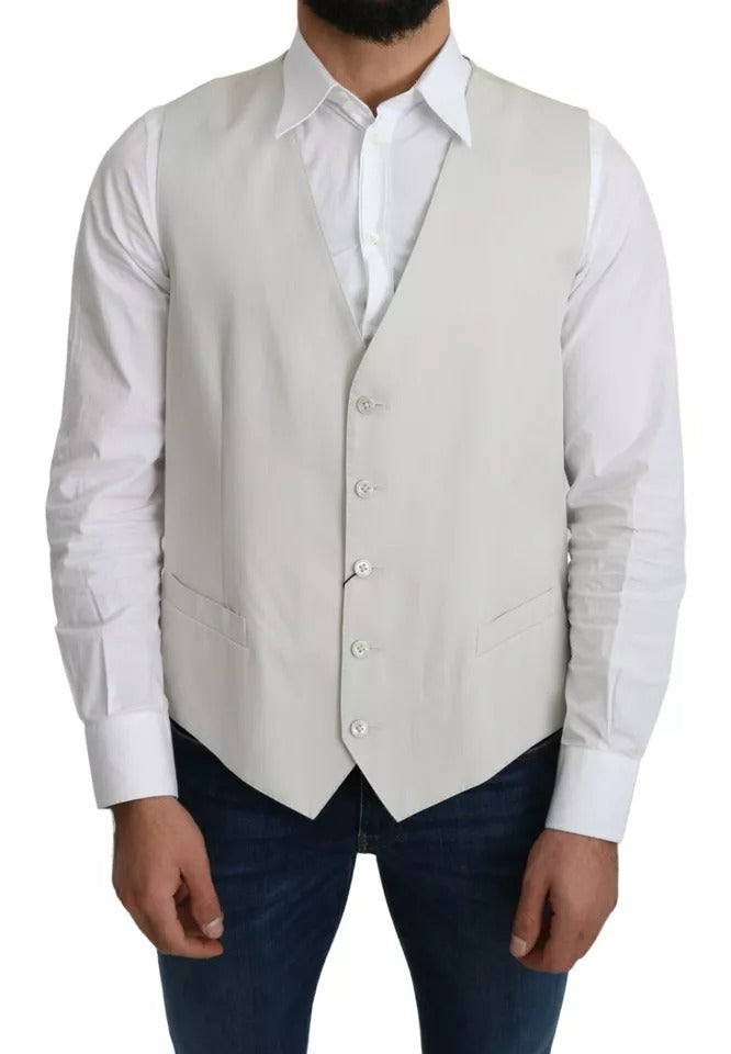 Indulge in the exquisite Dolce & Gabbana Off-White Cotton Silk Formal Coat Vest, a masterpiece of Italian craftsmanship that elevates your sophisticated allure for any occasion.