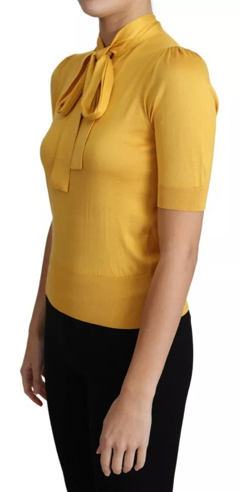 Indulge in the exquisite Dolce & Gabbana Yellow Silk Knit Pullover, a luxurious blend of artistry and elegance, perfect for making a sophisticated statement.