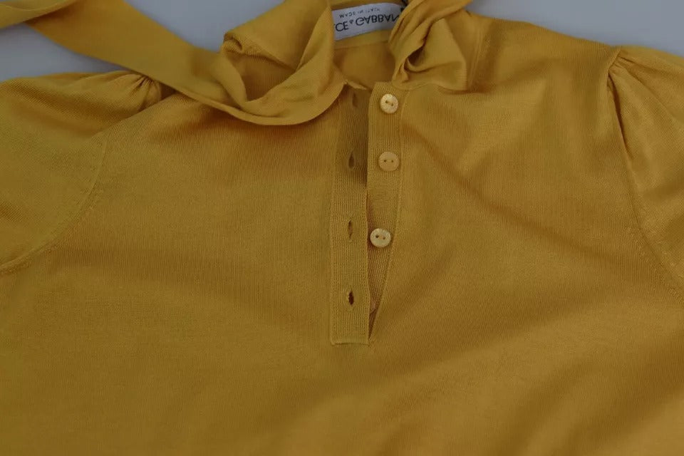 Indulge in the exquisite Dolce & Gabbana Yellow Silk Knit Pullover, a luxurious blend of artistry and elegance, perfect for those who embody sophistication and allure.