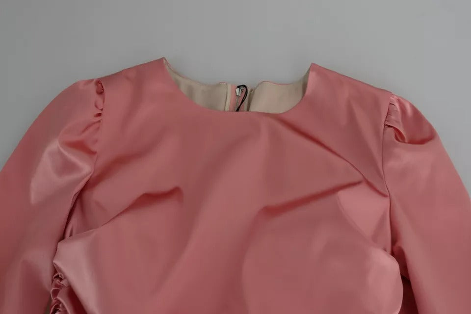 Indulge in the exquisite allure of the Dolce & Gabbana Pink Long Sleeves Bodycon Sheath Midi Dress, a masterpiece of luxurious craftsmanship and timeless elegance, perfect for every sophisticated occasion.