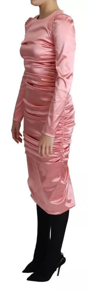 Indulge in the exquisite allure of the Dolce & Gabbana Pink Long Sleeves Bodycon Sheath Midi Dress, a timeless masterpiece crafted from luxurious fabrics, perfect for any elegant occasion.